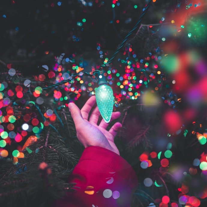 Colorful Christmas lighting in hand
