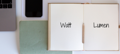 Open notebook with Watt and Lumen words on each page Open notebook with Watt and Lumen words on each page